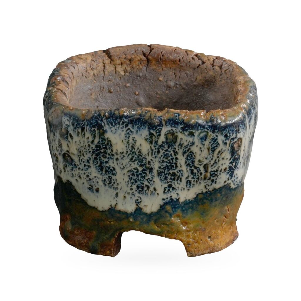 Mini square pot with cream-white and navy drip glaze over rust-brown clay on low feet