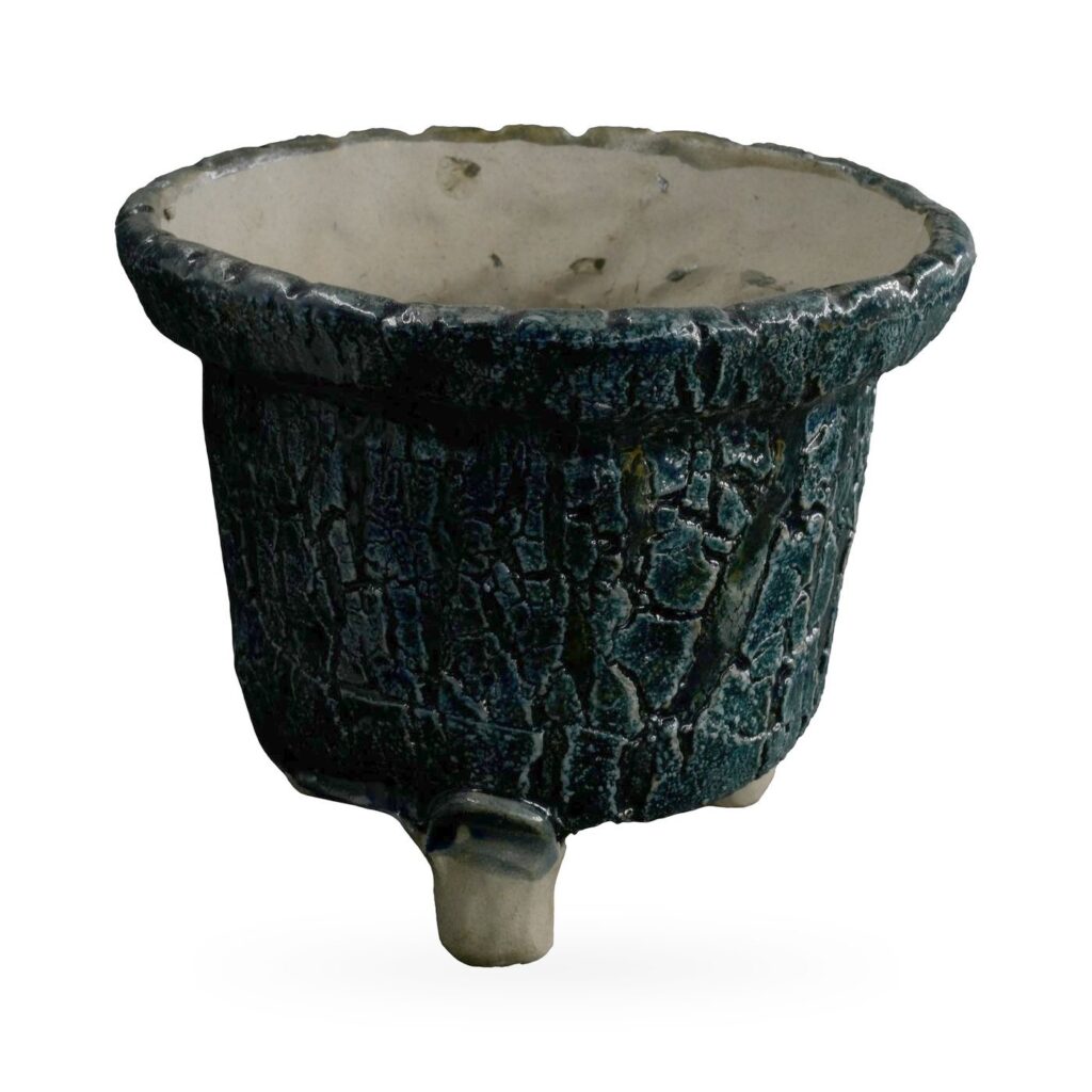 Tapered blue-black crackle glaze pot with scalloped rim on small stone-coloured feet