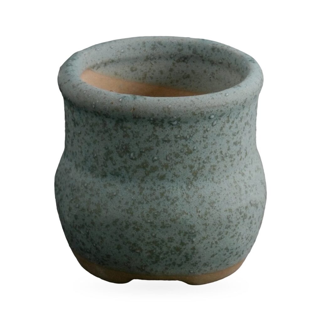 Small sage-green speckled matte pot with rolled rim and exposed clay base