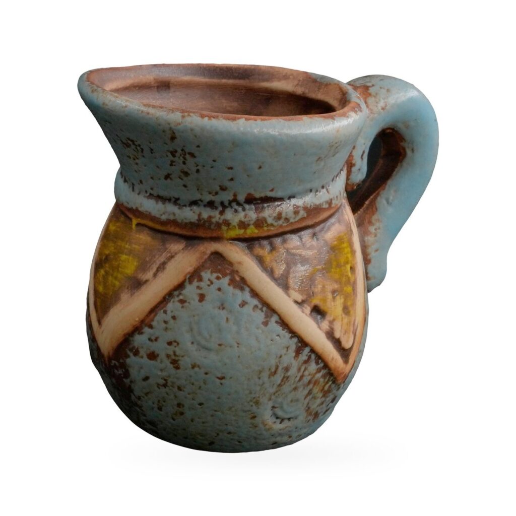 Small blue rustic jug-shaped pot with handle and a cream and yellow chevron band