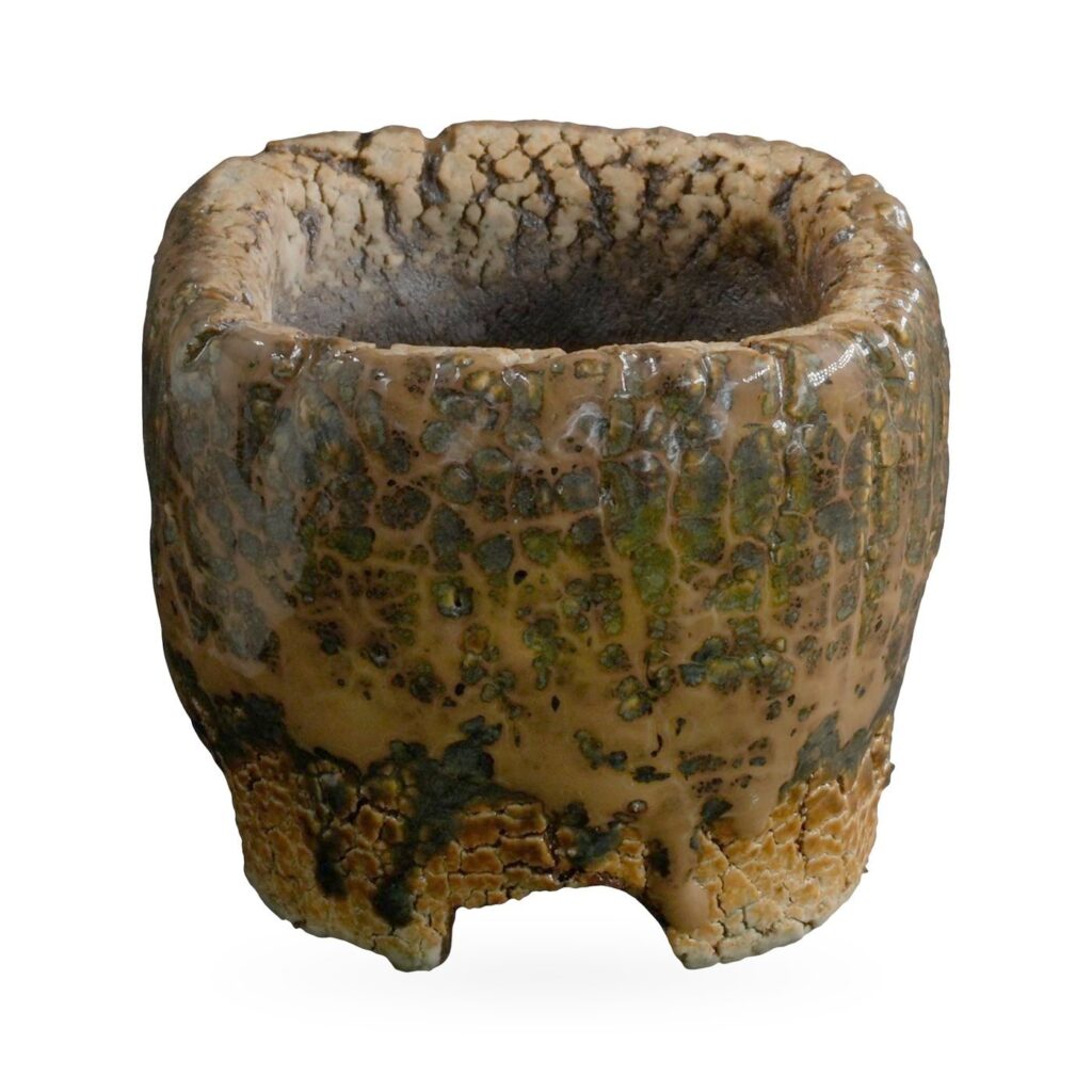 Mini rustic pot with glossy caramel drip glaze, olive mottling and small notched feet