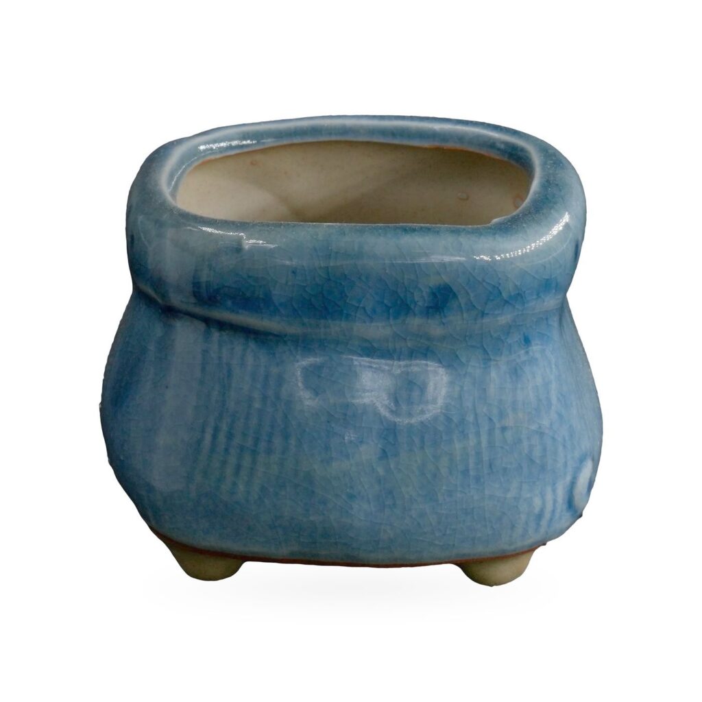 Denim-blue crackle-glazed sack-shaped pot with folded rim band and small feet, 8×6cm
