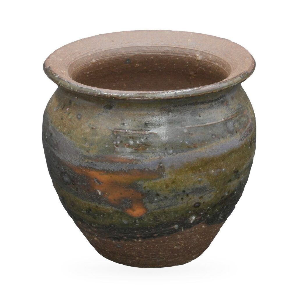 Round rustic pot with a flared brown rim and mottled charcoal, olive and rust glaze bands