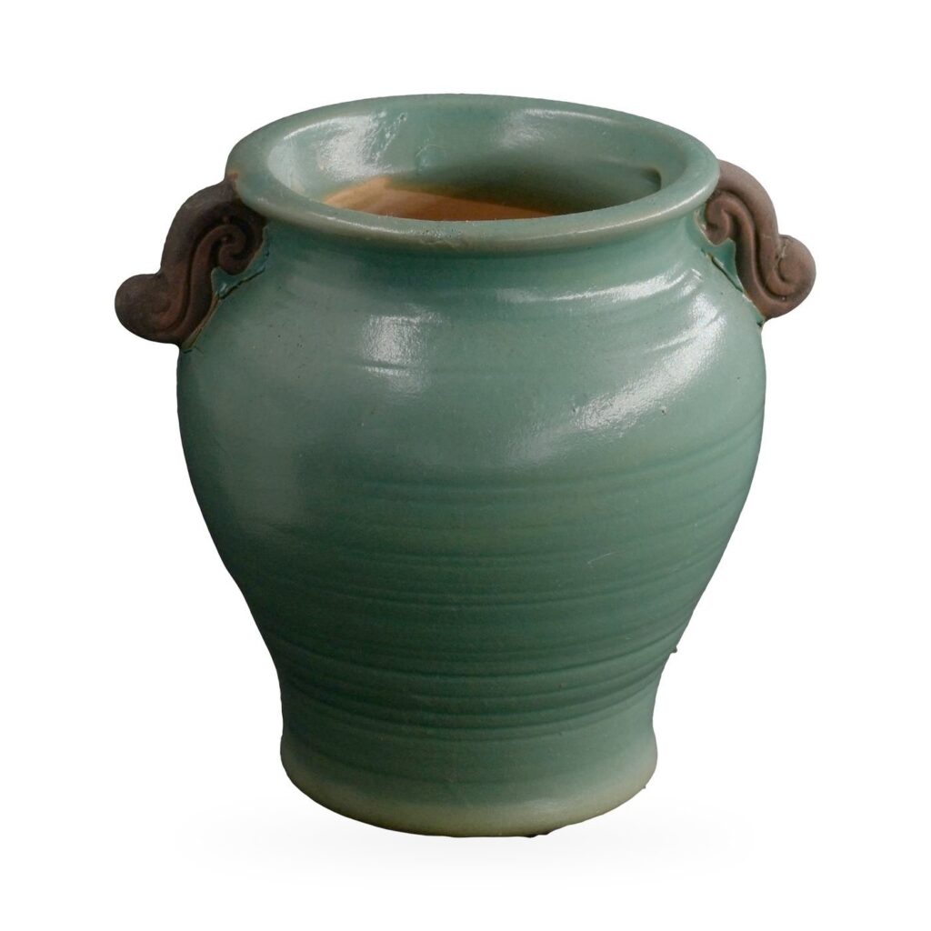 Teal-green glazed urn-shaped pot with rolled rim and two dark brown scroll handles
