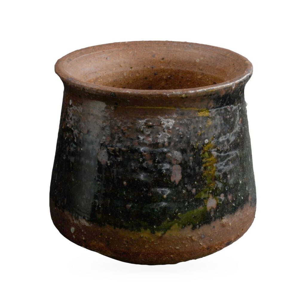Round pot with flared rim in glossy black glaze with olive streaks over speckled reddish-brown clay