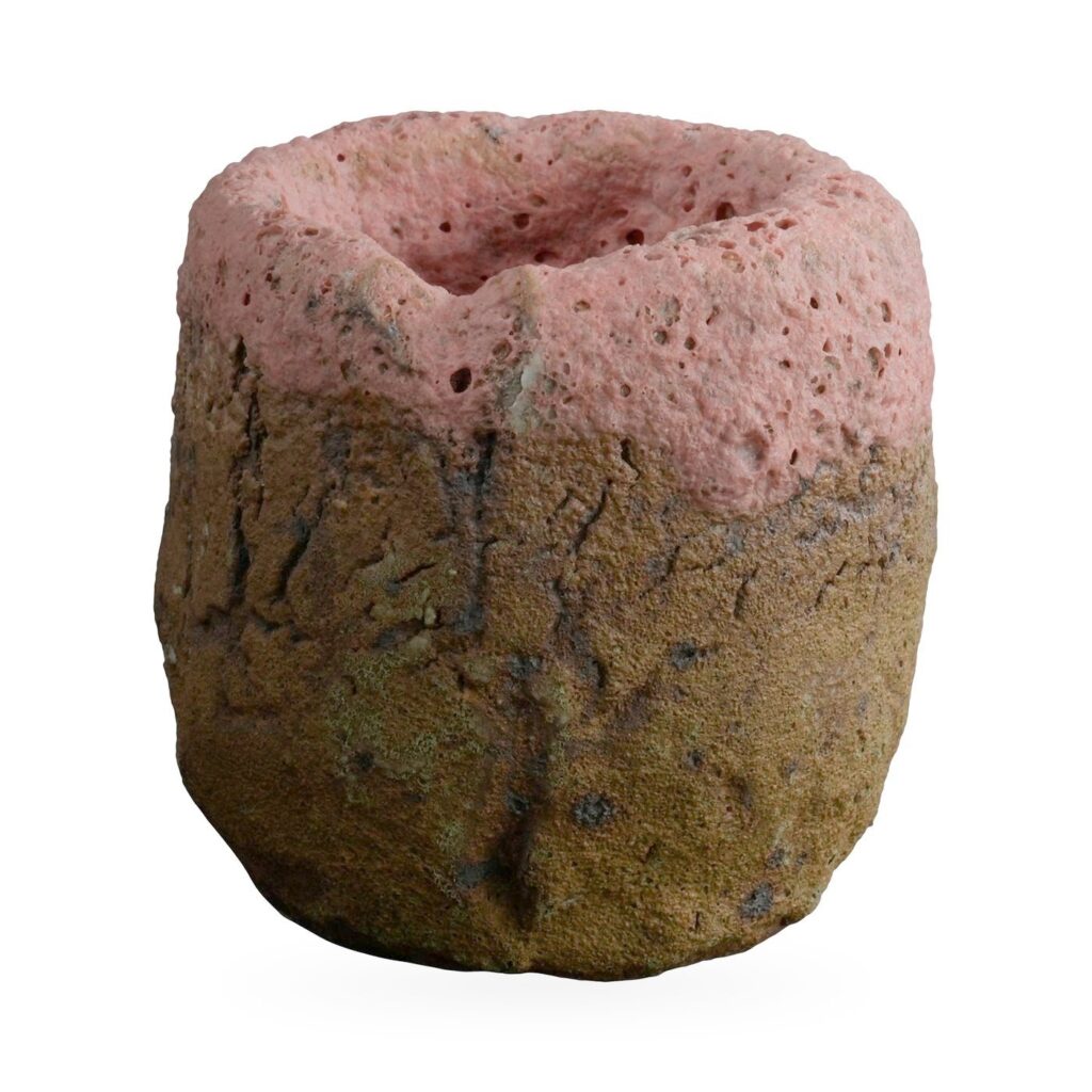 Two-tone cylinder pot with pitted coral-pink top and rough brown textured base, 7×6.5cm