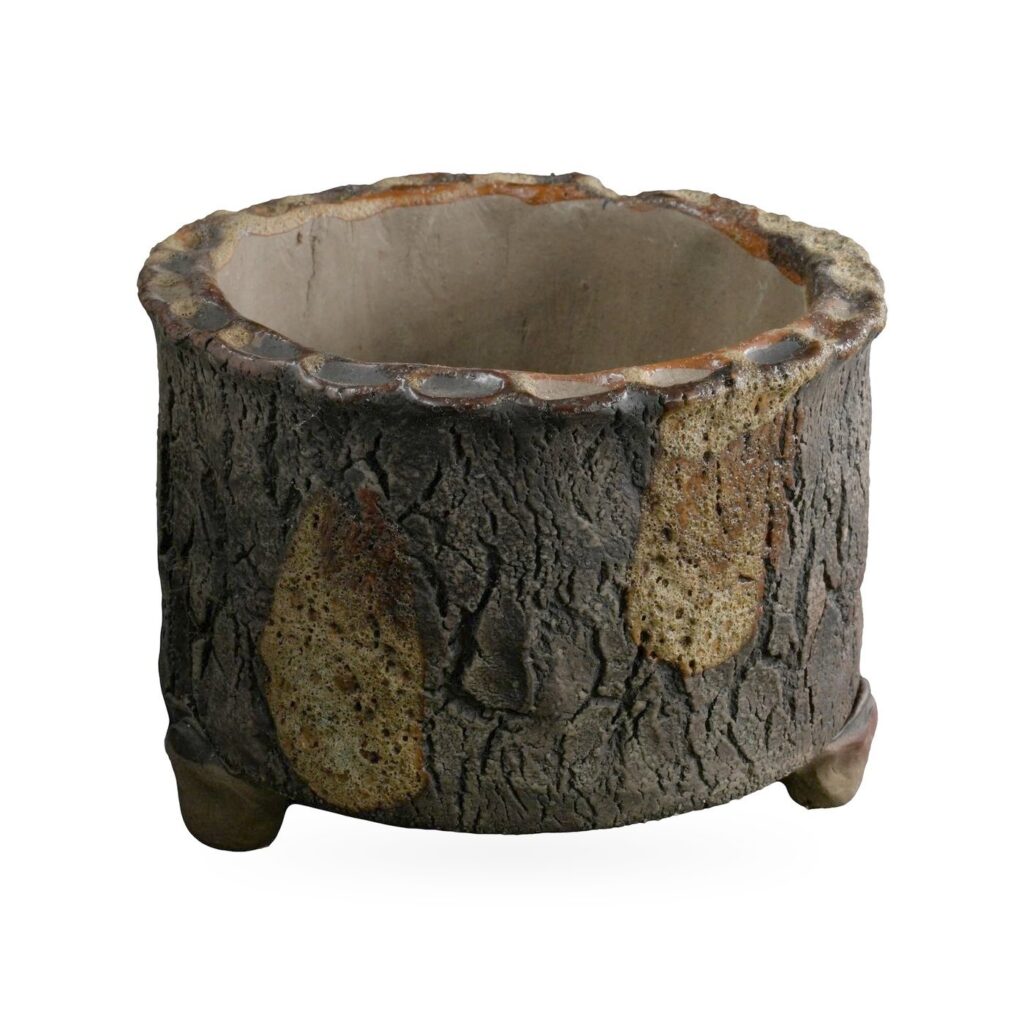 Round dark brown bark-texture footed pot with olive glaze drips and a scalloped rim
