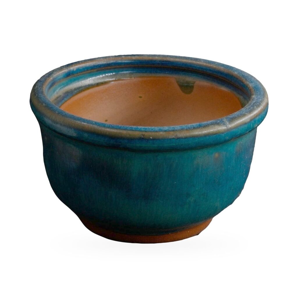 Small teal glazed bowl pot with rolled rim and terracotta-coloured interior