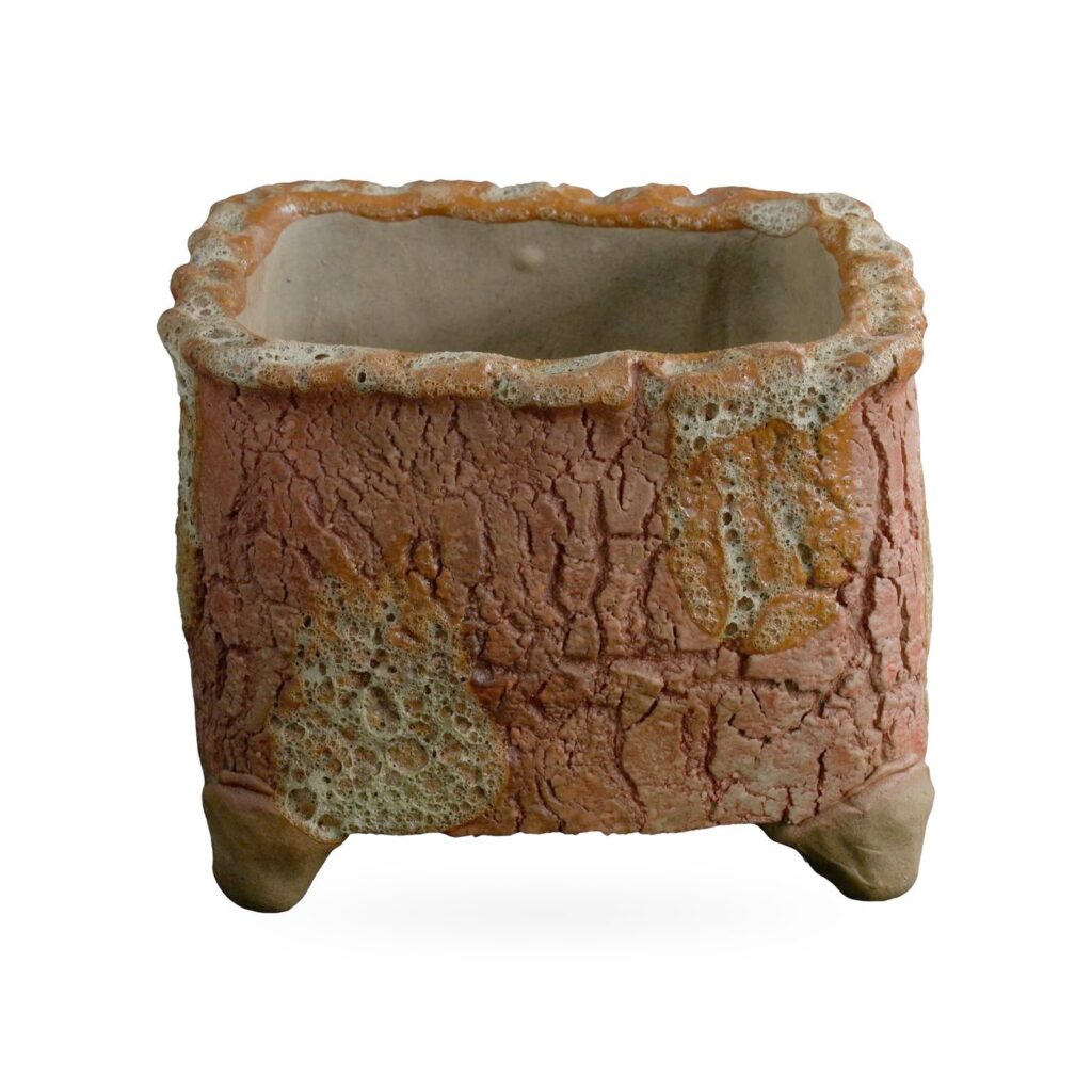 Square brick-red bark-texture footed pot with cream lava-style patches