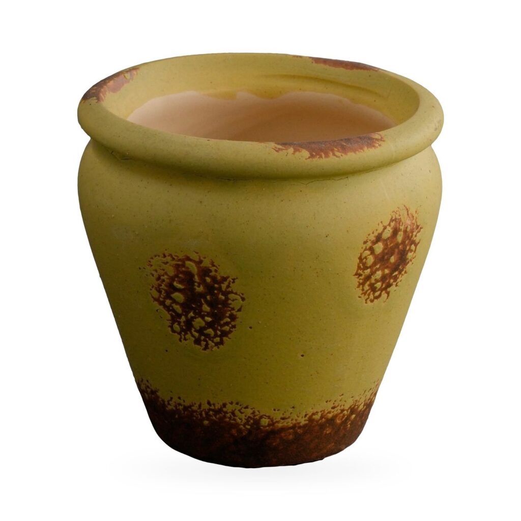 Small olive yellow vase-shaped pot with rust-brown speckled patches and distressed base