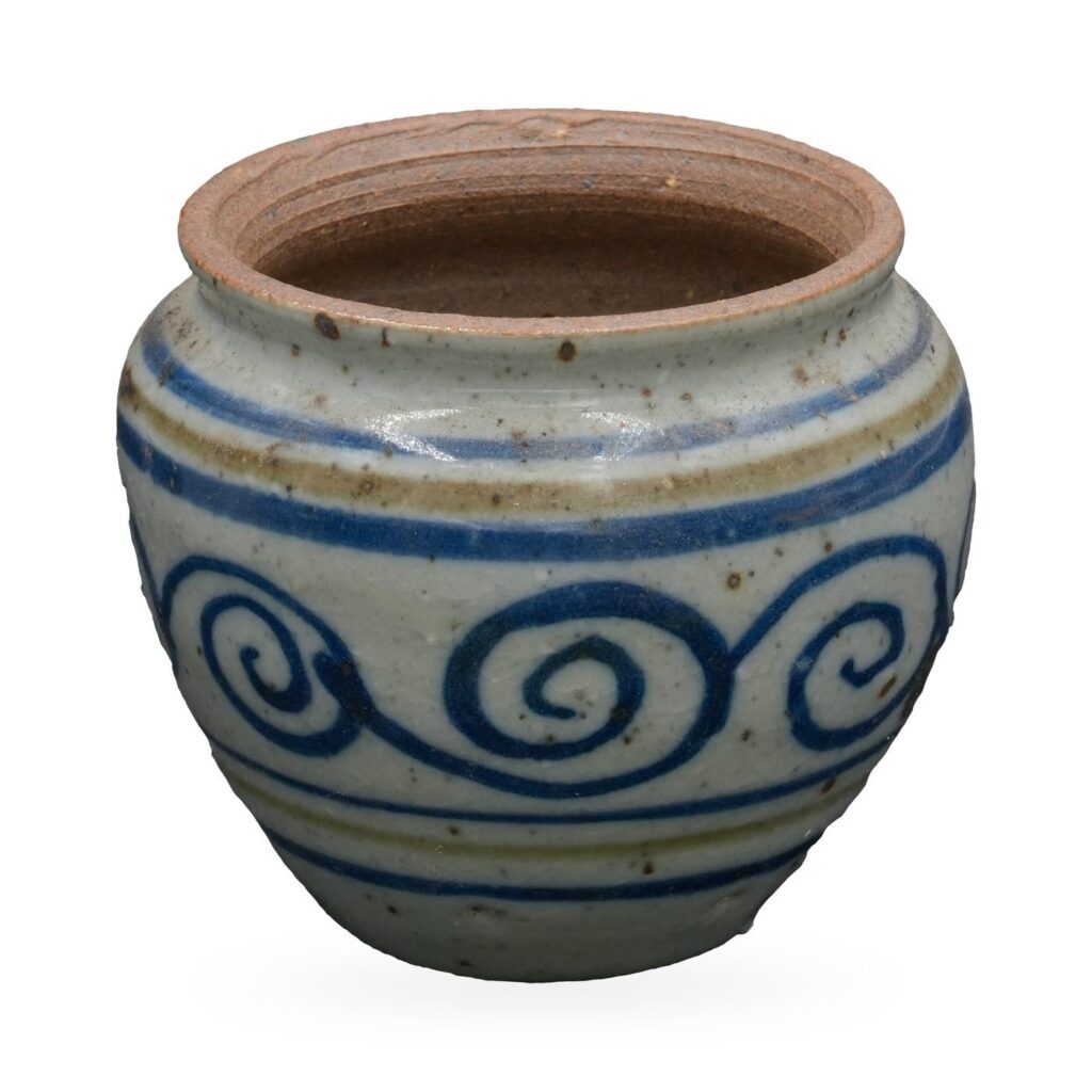 Rounded grey-white pot with a cobalt-blue scroll pattern, blue and olive stripes and brown clay rim