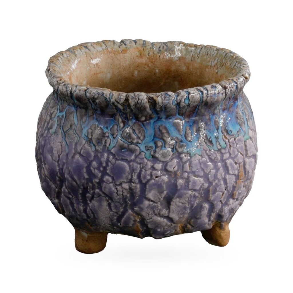 Lavender-purple crackle-glaze footed pot with a turquoise band and ruffled grey-blue rim, 10×8cm
