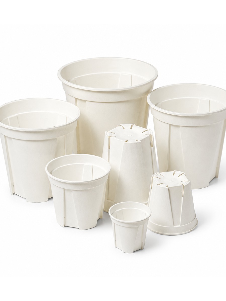 White plastic nursery pots with saucers